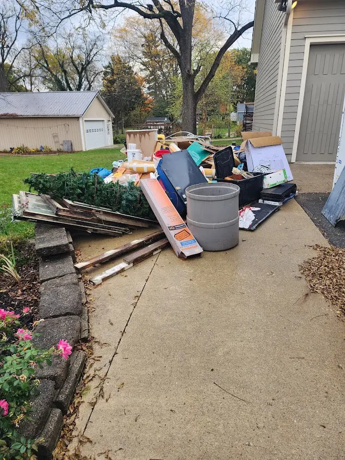 Dumpster being loaded with debris for 30 Yard Dumpster Rental in Rineyville